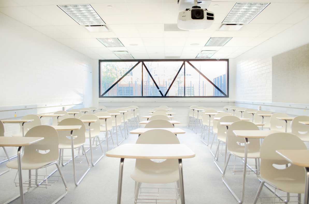 Modern Classroom with Flexible White Furniture and Plentiful Lighting