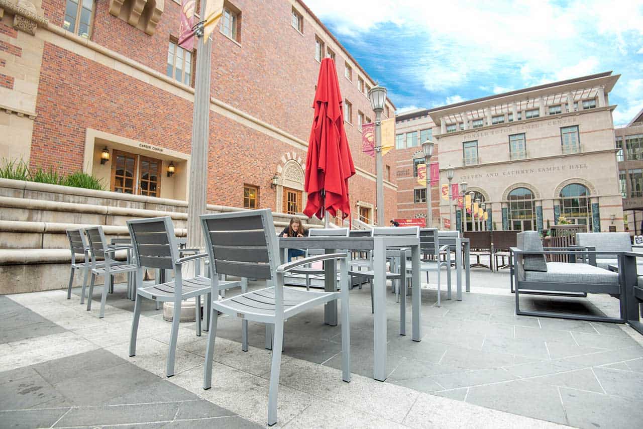 A shot of outdoor furniture: chairs, tables, and umbrellas at USC