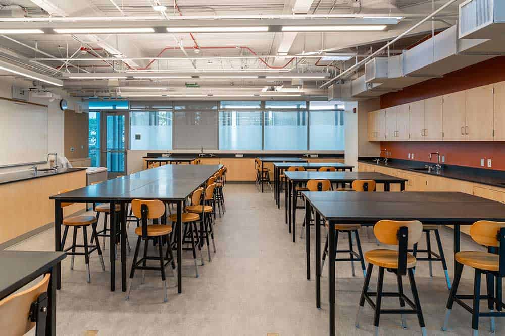 Contemporary Science Classroom Design with Chemistry Tables, Faucets, and Chairs