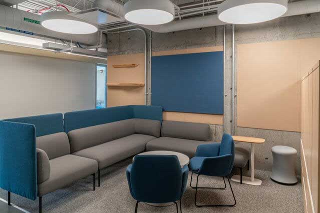 21st Century student lounge design featuring couch with privacy walls