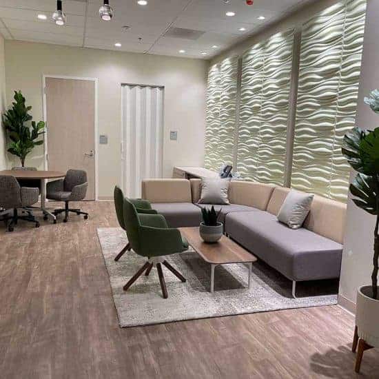 Medical Facility Waiting Area Design showing couch, chairs and table for USC Michelson Center