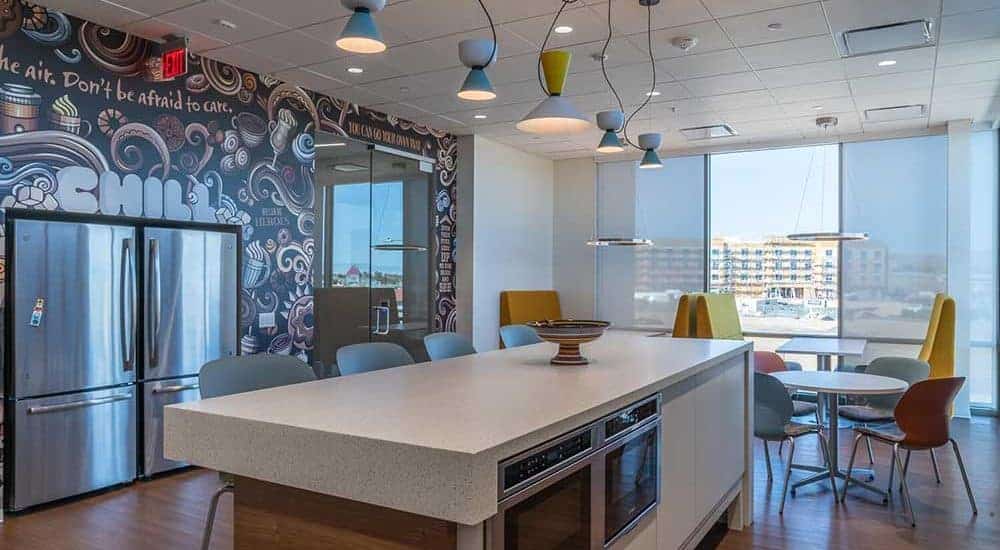 Modern break room featuring colorful chairs and lamps