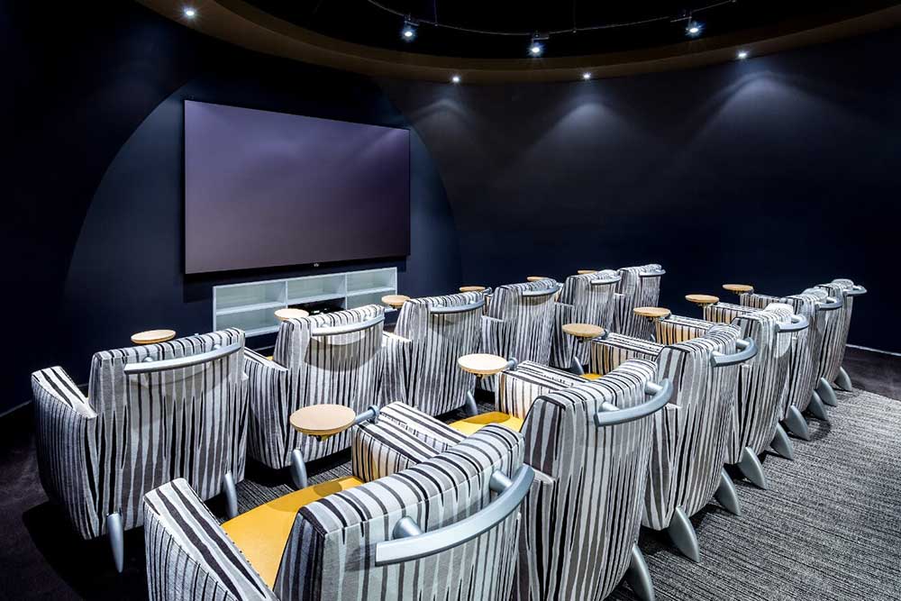 Company theater hosts meetings and employee movie nights in comfort and style