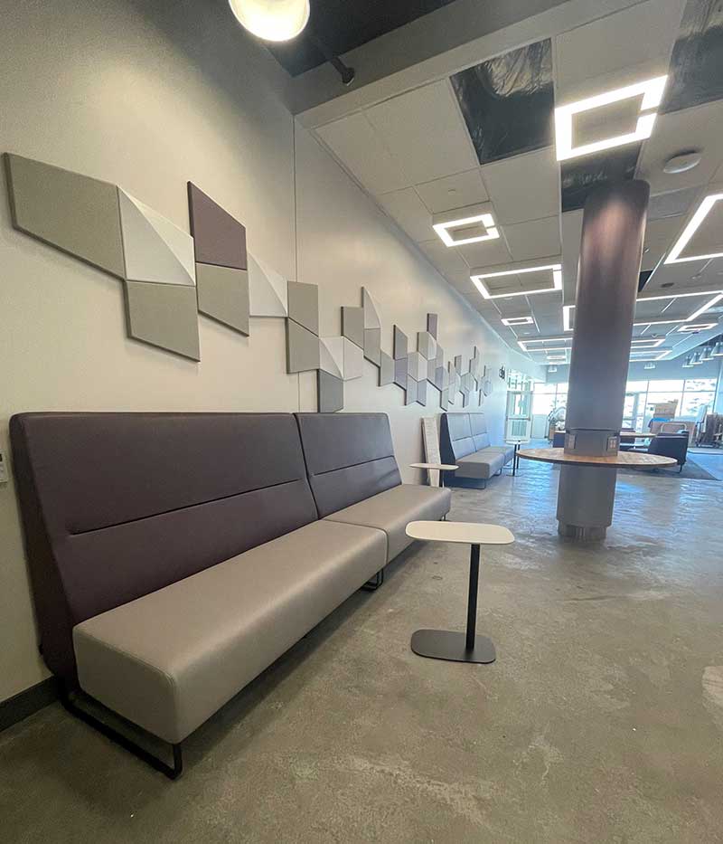 Image showing the openness of the 2nd floor lobby with wall seating and occasional tables.
