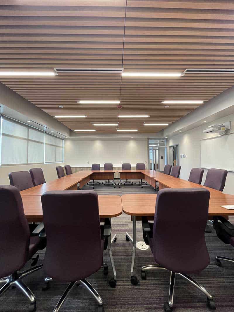 A second view of a 4th floor meeting room showing the tables with rounded corners.