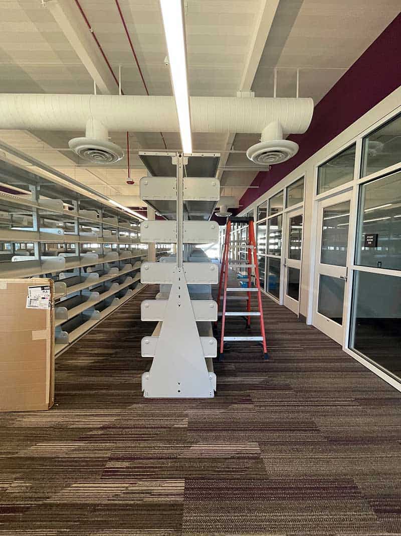 Library shelving being installed.